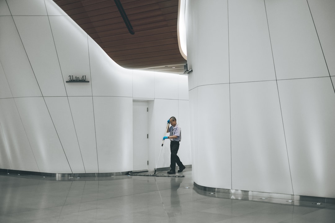 digital-01 man-cleaning-on-floor-beside-white-wall-mww-zrkysiu